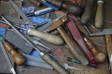 Collection of tools, including hammers, pliers, and scissors