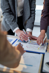 Business team analyzing financial data and discussing growth opportunities during a productive meeting