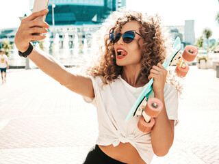 Young beautiful sexy smiling hipster woman with afro curls hairstyle.Trendy model in summer...
