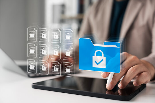 Secure data management concept with businessman using tablet. Locked digital folder and documents represent cybersecurity, file protection, privacy policy, and safe information storage. - Powered by Adobe