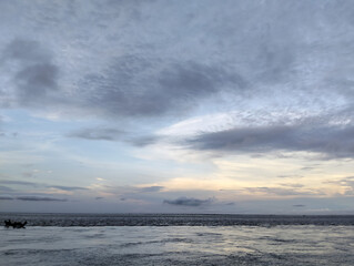 Cloudy sky and riverside view, The sky is cloudy and the ocean is calm
