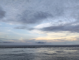 Cloudy sky and riverside view, The sky is cloudy and the ocean is calm