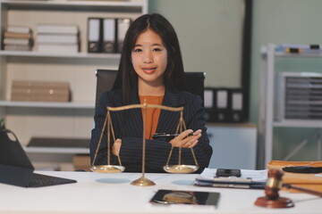 Judge gavel with Justice lawyers having team meeting at law firm background. Concepts of Law and...