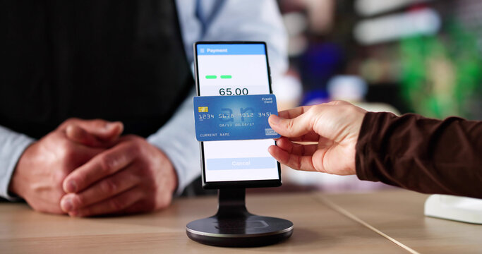 Woman Making Contactless Credit Card Payment