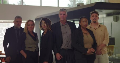 Diverse group of six professionals standing in modern office, serious expressions, business team posed together for group portrait in bright corporate environment - Powered by Adobe