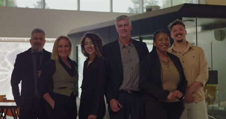 Diverse group of six professionals smiling in modern office space, business team standing together in bright indoor environment with friendly relaxed posture - Powered by Adobe