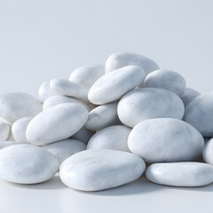A pile of smooth, white, natural stones, perfect for spa treatments, zen gardens, or decorative purposes