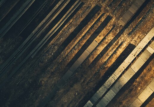 High-angle view of parallel metal beams on a textured ground