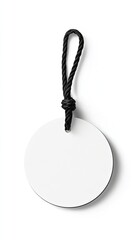 Blank circular tag with black cord.  White, round label, attached to a black cord with a simple knot