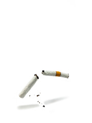 A broken cigarette against a plain white background.