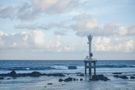 Beacon Tower in the Middle of the Sea with Waves and Clouds at pidakan beach pacitan east java indonesia