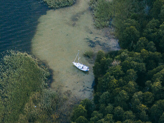 Aerial View of Boat in Shallow Water Near Shoreline