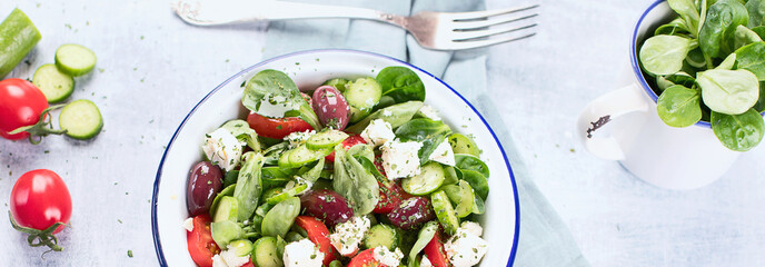 Fresh vegetable salad with feta cheese. Vegetarian food concept.