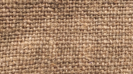 Close-up of fabric woven from burlap. Canvas texture. 