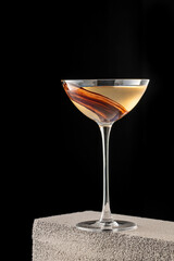 Elegant luxury cocktail in front of dark background