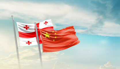 Georgia China friendship flags are waving in the sky. Two country flag for agreement or deal....