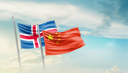 Iceland China flags waving in beautiful sky. Two country flag for agreement or deal. Iceland China...