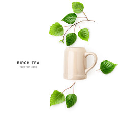 Birch leaves herbal tea and ceramic mug photography isolated on white background.
