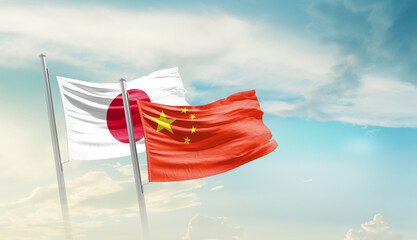 Japan China friendship flags are waving in the sky. Two country flag for agreement or deal. Japan...