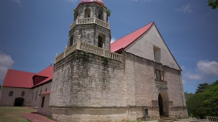 Trucking left to right across the old facade of Lazi church built with coral stone and hardwood.