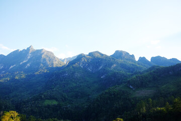 Fototapeta premium Beautiful landscape of valley Doiluang Chiangdao mountain with cloud and blue sky, Chiangmai Province of Thailand. Destination travel 