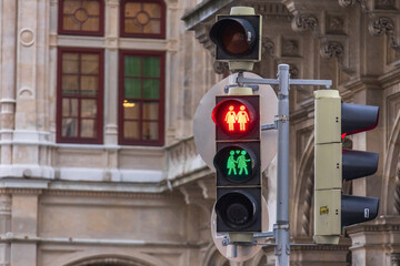 Close-up photo of couple pedestrian traffic light near Vienna State Opera in Austria, featuring...