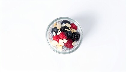 Chia pudding in glass jar with berries and almond slices isolated on white background for healthy breakfast or dessert concept