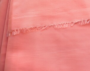 Orange capron fabric macro. Textile close-up.