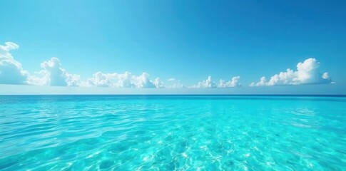 Turquoise waters meet clear blue sky at perfect horizon, sea, shore