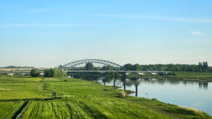Bridge over IJssel river near Zwolle blue sky nature landscape.