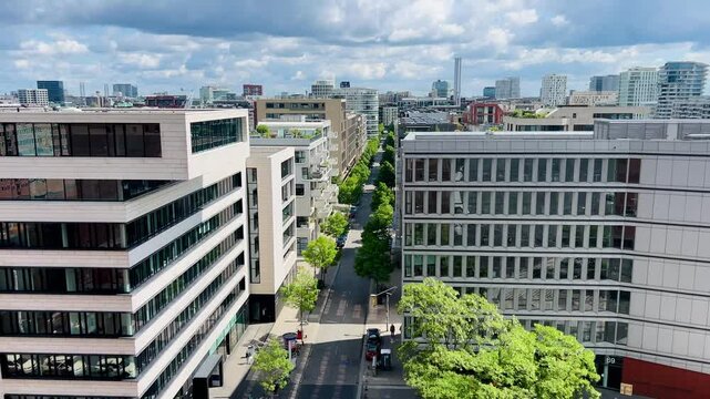 Hamburg, Germany - April 20, 2025: Hafen City Street Towards the Elbe Philharmonic Hall. Sandtorhafen. Traditionsschiffhafen in Hafencity. Old Town, Town houses. Modern residential, office building