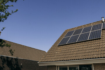 Solar panels on roof house. Clean energy, green energy, sustainability, eco-friendly technology...