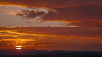 Fototapeta premium Sunset color gradient from orange to deep red