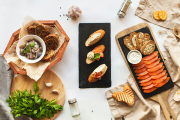Nordic appetizer trio with herring, bruschetta, and cured salmon