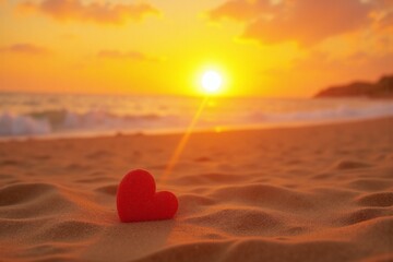 red heart sitting on top of a sandy beach