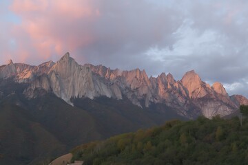 Pink sky over jagged mountain range