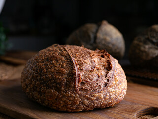 loaf of fresh baked sourdough bread.ciabatta bread set on wooden table.