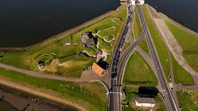 Cars queuing to kornwerderzand on the afsluitdijk causeway in the netherlands