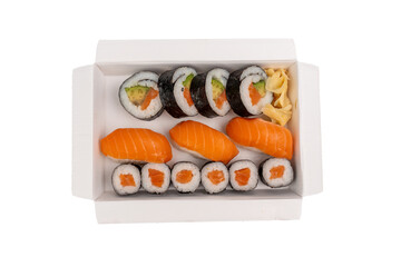 Sushi box photographed from above with salmon nigiri, maki with salmon and avocado, and pickled ginger. The arrangement is aesthetically pleasing and perfect for food advertising. Sushi on a transpare © Jakob