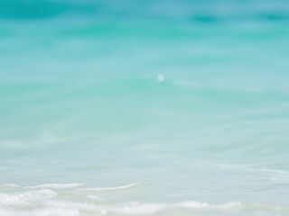 Serene coastal scene with calm turquoise water and gentle waves during summer