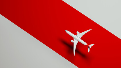 Commercial airliner flying over bold red background