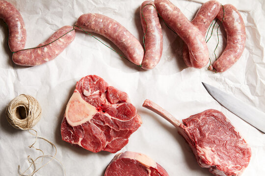 Fresh cuts and sausages on butcher paper