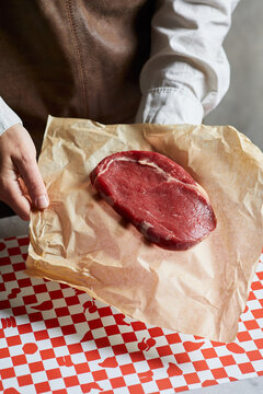 Fresh beef cut on butcher paper ready for preparation