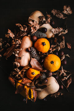 Rustic autumn arrangement with pumpkins and leaves