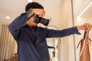 Photographer capturing handbag in trendy store