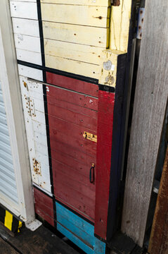Painted wood door in geometric blocks, Chew Jetty, Malaysia