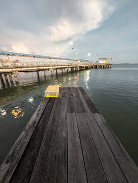 Fototapeta Concrete pier extending into the sea, Chew Jetty, Georgetown, Malaysia