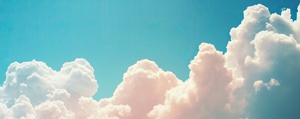 Fluffy white clouds against a bright blue sky