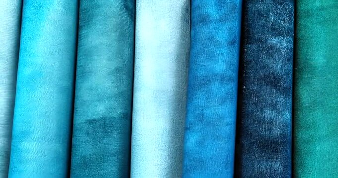 Collection of dyed fabrics in shades of teal and blue