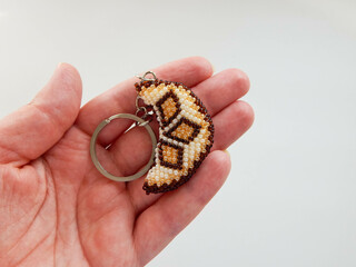 Hand holding a colorful keychain